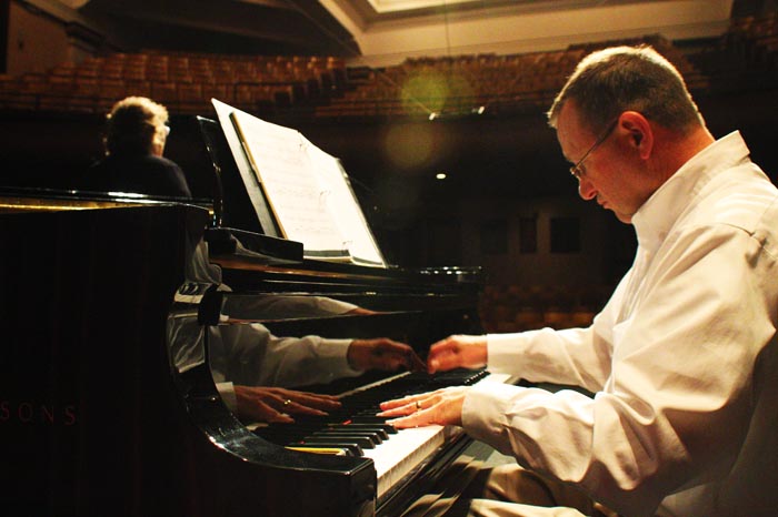 Julie Wieck and Gerald Berthiaume practice in the Bryan Hall Theatre Wednesday, Sept. 25, 2013.