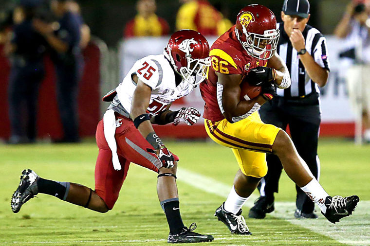 Freshman+cornerback+Daqwuan+Brown+attempts+to+tackle+a+USC+defender+during+last+weekend%E2%80%99s+game+at+the+Los+Angeles+Coliseum%2C+Saturday%2C+Sept.+7.