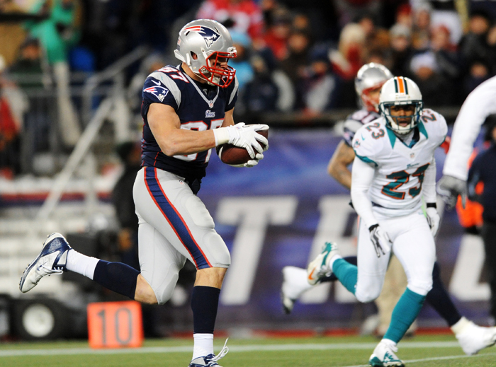 New England Patriots tight end Rob Gronkowski scores a touchdown late in the fourth quarter against the Miami Dolphins at Gillette Stadium in Foxboro, Mass., Sunday, December 30, 2012.