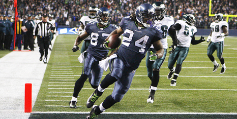 Seattle Seahawk’s running back Marshawn Lynch scores against the Philadelphia Eagles during an NFL game in Seattle, Washington, Thursday, Dec. 1, 2011.
