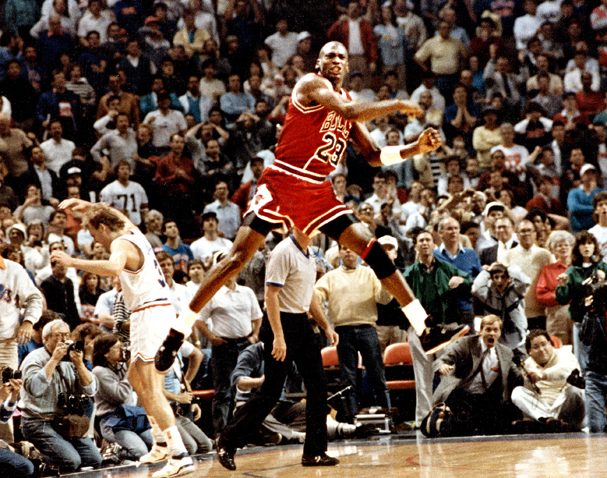 The Chicago Bulls Michael Jordan reacts after hitting the game-winning basket over Clevelands Craig Ehlo, left rear, in Game 5 of the NBA playoffs May 7, 1989, in Cleveland, Ohio.