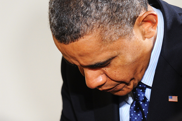 President Obama bows his head in prayer during the Easter prayer breakfast Apr. 5 at the White House.