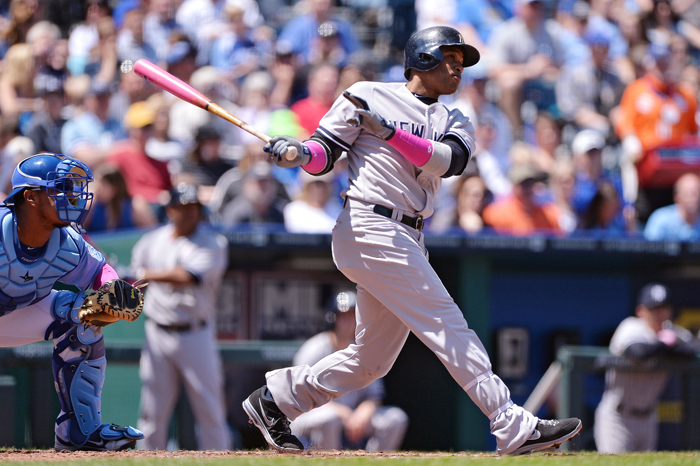 Robinson Cano hits a home-run against the Royals during the third inning at Kauffman Stadium in Kansas City, Miss., Sunday, May 12.