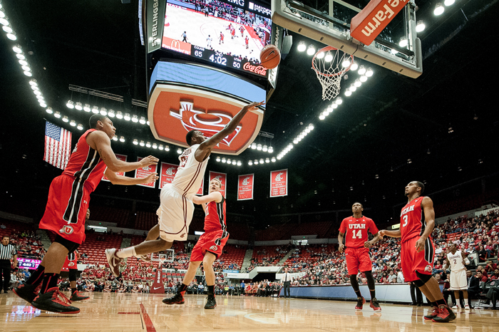Redshirt senior forward D.J. Shelton drives to the basket and finishes a running lay up during a home game against Utah, Wednesday, Jan. 16. The Cougars defeated the Utes 75-65 to earn their first Pac-12 victory of the season.