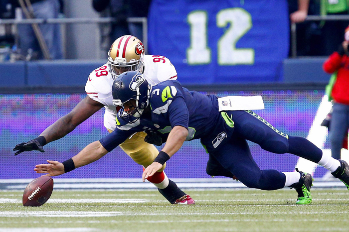 Russell Wilson scrambles for a fumble during the NFC championship game at CenturyLink Field, Jan. 19.