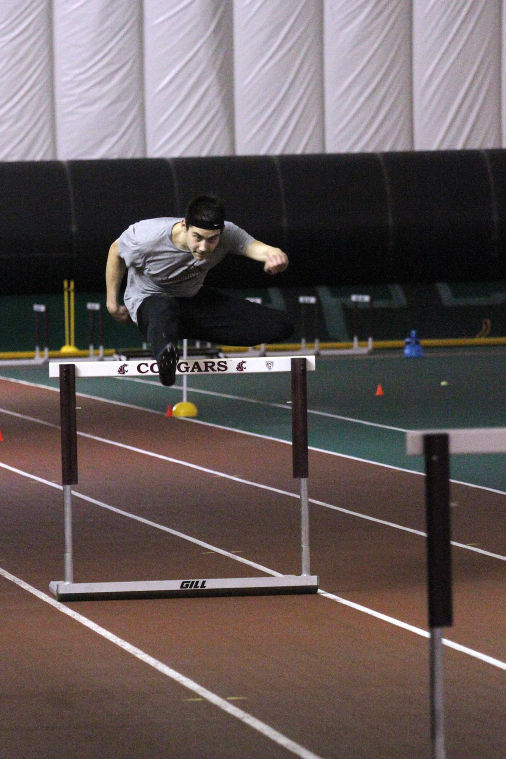 Freshmen+Daniel+Zmuda+leaps+over+a+hurdle+during+a+track+practice+in+the+Indoor+Facility%2C+Wednesday%2C+Feb.+12.