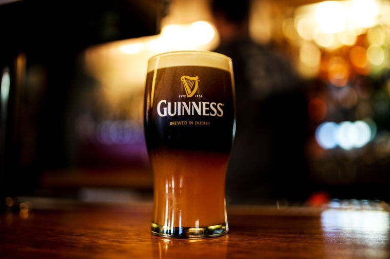 A Guiness and Blue Moon mixture is poured into a glass at The Cougar Cottage, Monday, March 10.