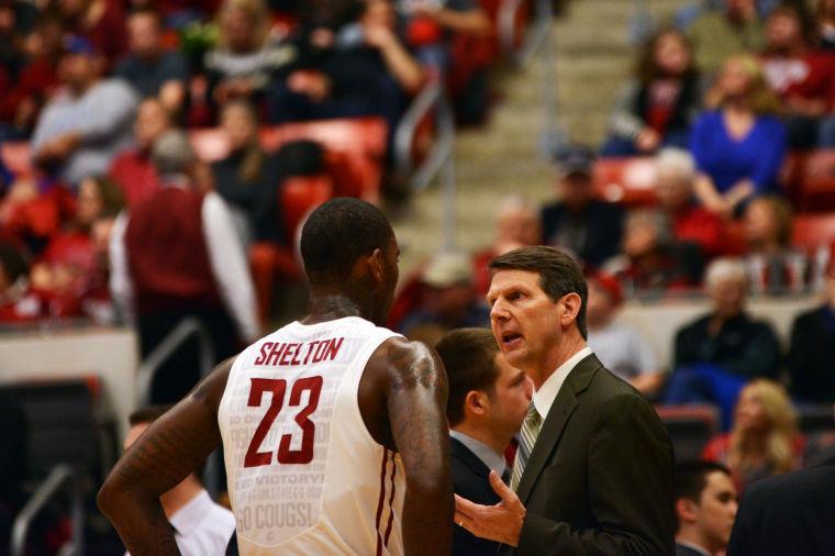 Head Coach Ken Bone speaks to redshirt senior D.J. Shelton during a home game against UCLA, Satuday, March 8.