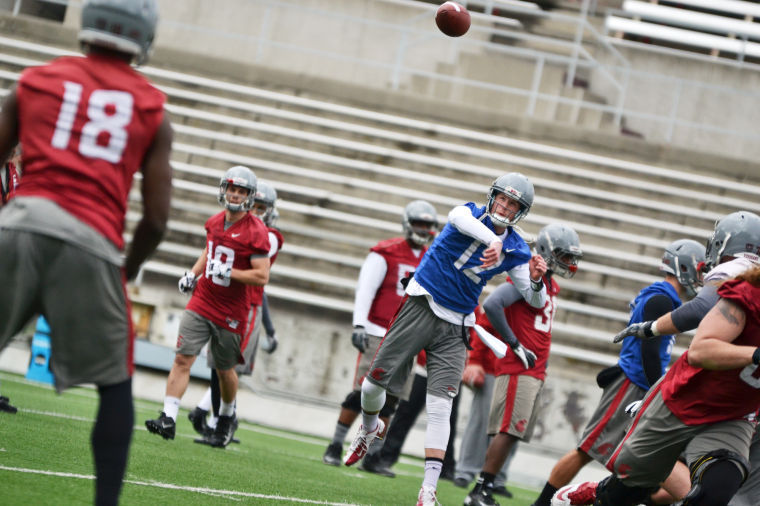 Quarterback+Connor+Halliday+fires+a+pass+during+practice+at+Martin+Stadium%2C+Thursday%2C+March+27.