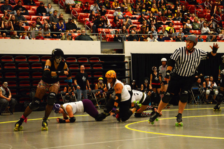 The+Rolling+Hills+Derby+Dames+compete+during+a+bout+at+Beasley+Coliseum%2C+Oct.+19%2C+2013.