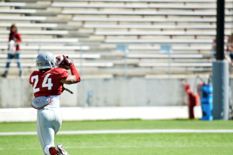 Redshirt+senior+running+back+Theron+West+catches+a+pass+during+a+practice+at+Martin+Stadium%2C+April+3.