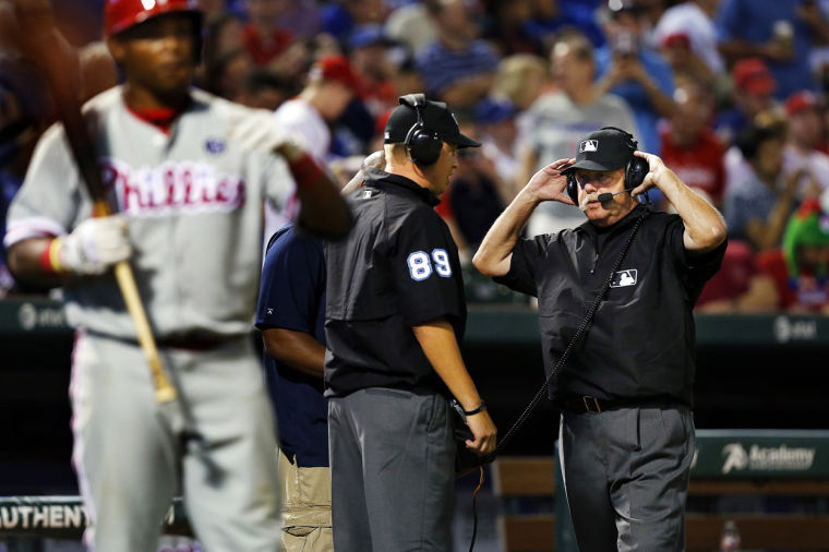 Umpire+crew+chief+Jim+Joyce+dons+a+headset+to+discuss+a+replay+during+a+game+between+the+Philadelphia+Phillies+and+the+Texas+Rangers+at+Globe+Life+Park+in+Arlington%2C+Texas%2C+April+1.