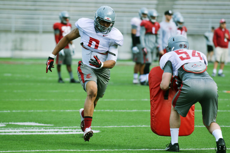 WSU linebacker Jeremiah Allison participates in a special teams drill during practice at Martin Stadium, Tuesday, April 1.