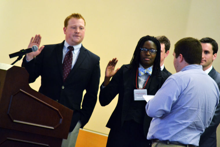 Jared+Powell+and+LaKecia+Farmer%2C+ASWSU+president+and+vice-president+for+2014-2015%2C+are+sworn+into+office+during+an+inauguration+in+the+CUB+Senior+Ballroom%2C+Thursday%2C+April+24.