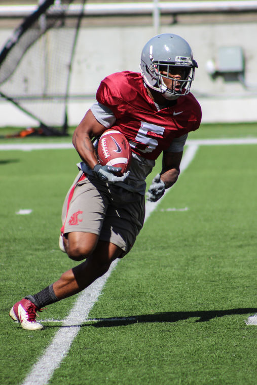 WSU+wide+receiver+Rickey+Galvin+carries+the+ball+during+a+spring+practice%2C+Saturday%2C+April+5.%C2%A0