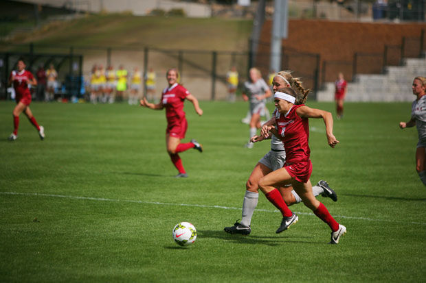 Sophomore+forward+Kaitlyn+Johnson+dribbles+the+ball+past+her+Montana+defender+on+Lower+Soccer+Field%2C+Sunday%2C+Aug.+31%2C+2014.+The+Cougars+beat+the+Grizzlies+2-0.
