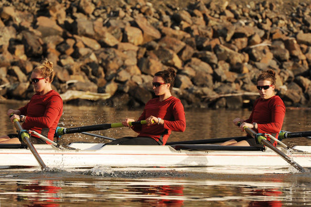 WSU junior Nicole Hare (middle) strokes during a womens crew meet on the Snake River, Oct. 15, 2013.