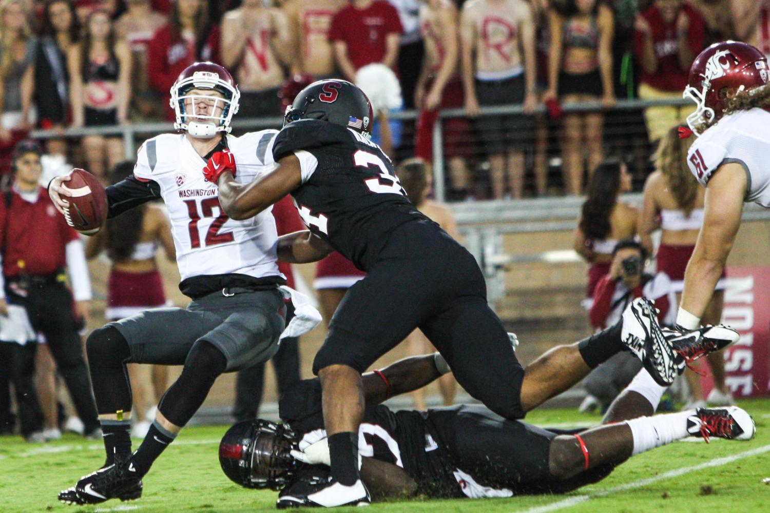 Redshirt+senior+quarterback+Connor+Haliday+is+sacked+by+Stanford+defenders%2C+Oct.+10%2C+2014.%C2%A0