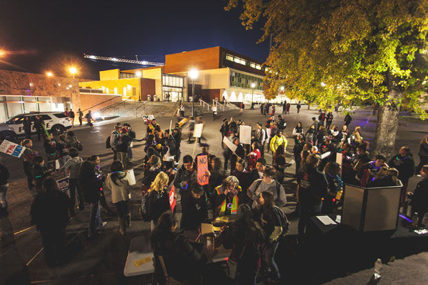 Students rally on the steps outside of Todd Hall during the annual Take Back the Night event Thursday, Dec. 17, 2013.