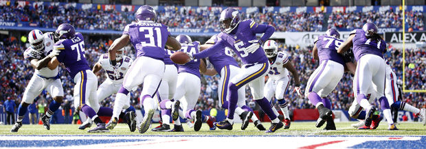 Vikings+rookie+quarterback+Teddy+Bridgewater+%285%29+hands+the+ball+off+to+fellow+rookie+Jerick+McKinnon+%2831%29+in+a+game+against+Buffalo%2C+Sunday%2C+Oct.+19%2C+2014.