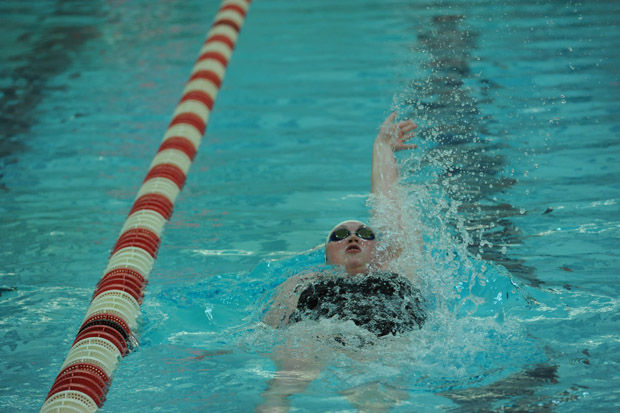 Junior Shaya Scaedler swims in a meet during the 2014-2015 season.