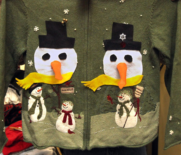 A detailed view of one of the uglier Christmas sweaters that is part of the stash of owner Troy Zulich, taken at his warehouse, Dec. 11, 2013, in Akron, Ohio. Ugly Christmas sweaters and vests have become a staple for guests at holiday parties to wear. (Ed Suba Jr./Akron Beacon Journal/MCT)