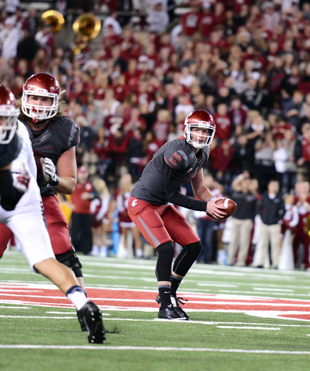 Redshirt senior quarterback Connor Halliday looks over the line of scrimmage against California, Oct. 4, 2014, at Martin Stadium. Halliday will attend the NFL Scouting Combine this week.