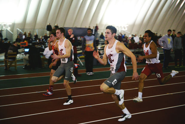 WSU sprinters Zach Smith (left) and Kyle Farmer (right) run in the Mens 60m dash in the Cougar Indoor track meet, Feb. 7, 2015.