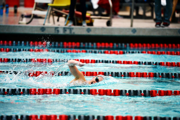 WSU swimmer performs the freestyle during a meet against Utah in Gibb Pool, Friday, Feb. 13, 2015.