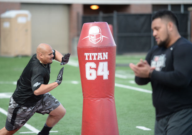Defensive lineman Xavier Cooper participates in position drills at Washington State Universitys Pro Day, March 12, 2015.