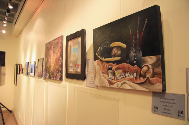 Works on display in the Reinterpreting Reality exhibit in the CUB Gallery featuring women artists.