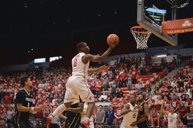 WSU sophomore guard Ike Iroegbu lays the ball up in a game against Colorado in Beasley Coliseum, Sat. March 7, 2015. The Cougars scratched out a win in overtime to finish off the season with a final score of 96-91.