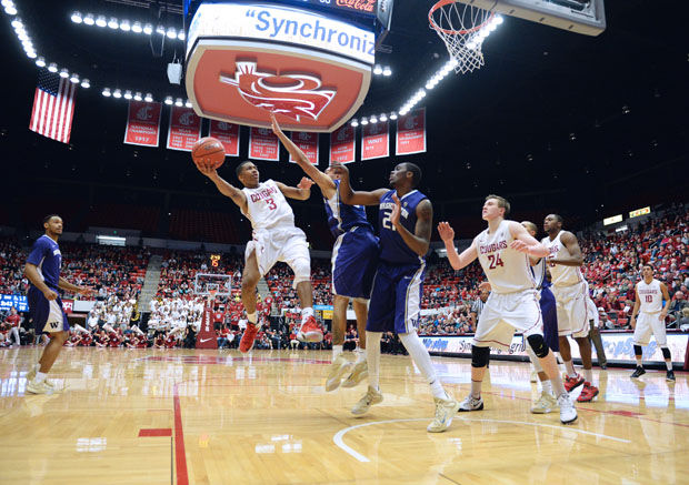 Freshman guard Ny Redding attempts to make a lay-up against UW in Beasley Coliseum, Feb. 22, 2015.