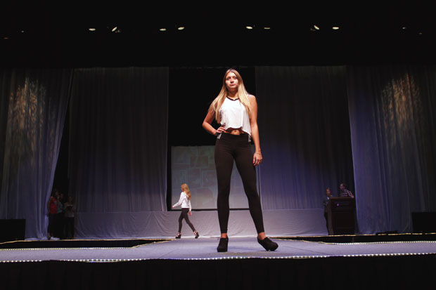 Nicole Anderson, sophomore fashion merchandising major, rehearses for the 32nd annual Mom’s Weekend Fashion Show, Wednesday, April 8, 2015.