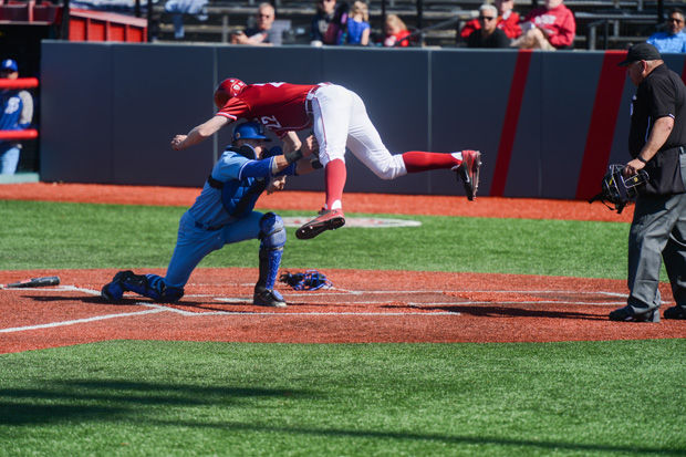 WSU freshman left-handed pitcher and first baseman Tyler McDowell jumps to home plate during a game against San Jose State in Bailey-Brayton field, Saturday, April 18, 2015.