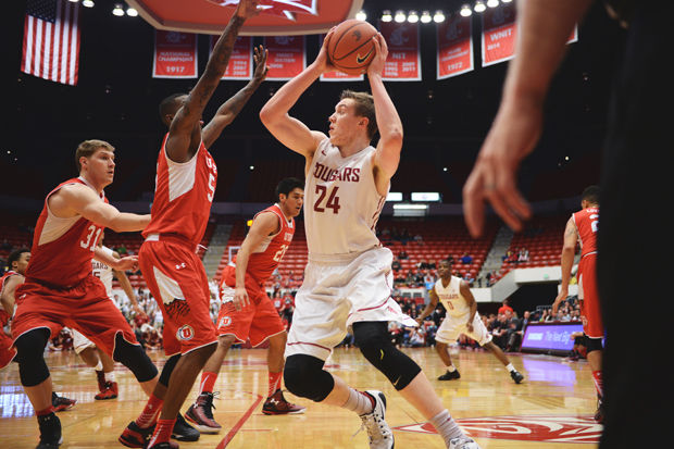 WSU sophomore forward Josh Hawkinson drives to the basket against Utah at Beasley Coliseum, March 5, 2015.