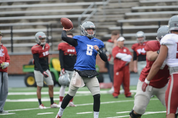 Quarterback Peyton Bender throws in practice at Martin Stadium, Tuesday, March 31, 2015. Bender has shared first team reps at quarterback during spring practice.
