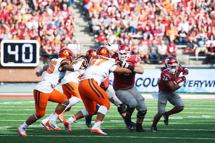 Redshirt freshman running back Keith Harrington comes off the end as members of the offensive line block for him during a game against Oregon State in Martin Stadium, Oct. 16.