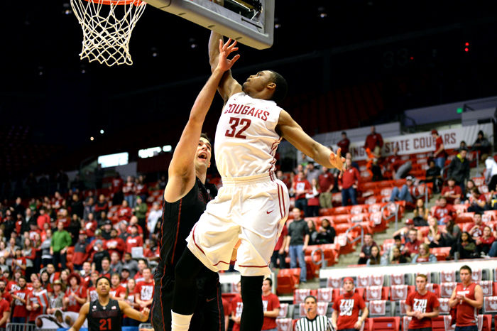 Redshirt junior Que Johnson jumps for a lay up during a game against Stanford in Beasley Coliseum, Feb. 1, 2015.