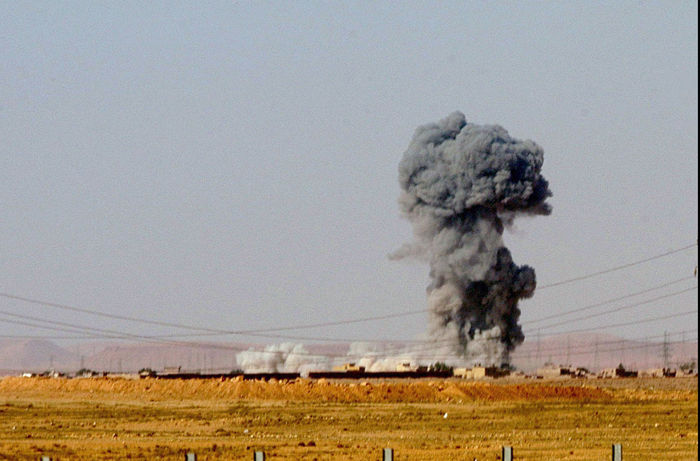 Russia and the US are both fighting ISIL, yet support opposite sides of the Syrian Civil War. The village of Rotba is hit by a U.S. missile, as seen from the road between Baghdad and the Syrian border, Tuesday April 1, 2003. 