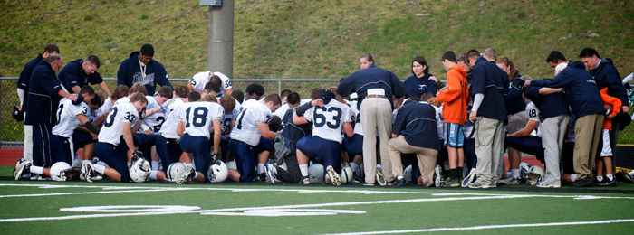 Bellarmine Prep’s football team prays before a game, Oct. 1, 2010. Prayer before or after sports is practicing freedom of religion. 