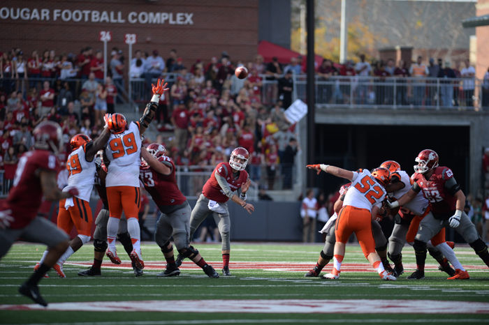 Redshirt sophomore quarterback Luke Falk passes the ball down field during a game against Oregon State in Martin Stadium, Oct. 17, 2015.