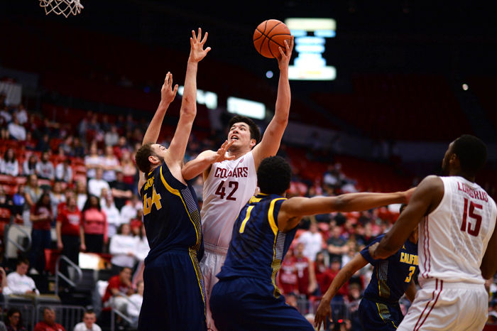 Redshirt junior center Conor Clifford attempts to score during a game against Oregon at Beasley Coliseum on Feb. 21.