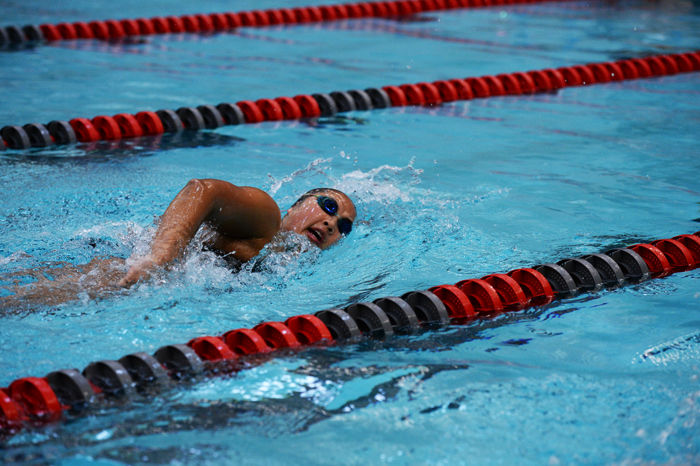 A WSU swimmer races during a heat against Utah in Gibb Pool on Feb. 13, 2015.