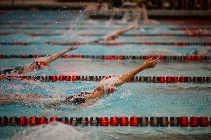 A+WSU+swimmer+races+during+a+heat+against+the+University+of+Nebraska+in+Gibb+Pool+on+Jan+29.