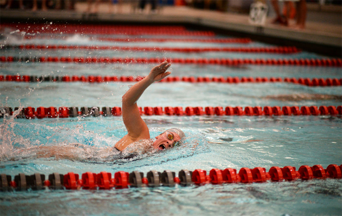 A WSU swimmer races during a meet against the University of Nebraska at Gibb Pool on Jan. 29.