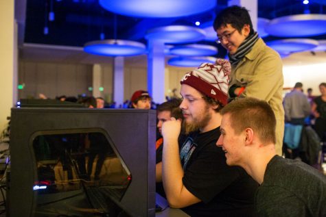 Foreground to background: Dylan Ward, Eric Amundsen and Kevin Lee warm up for a League of Legends tournament.