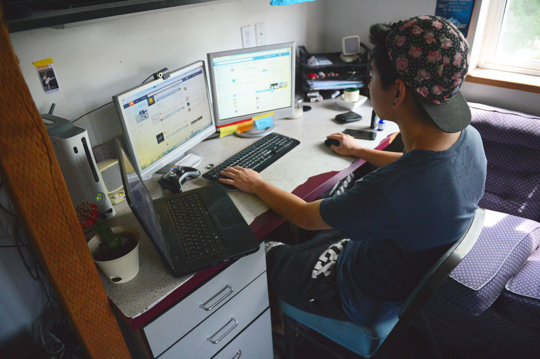 Former WSU student Daniel Nam browses the internet on multiple monitors. More than 3,000 students are enrolled in WSUs Online Global Campus