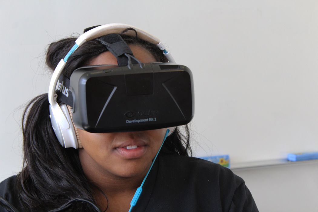 Sponsorship coordinator Camilla Smith works on programming for use on an Oculus Rift development kit. A partnership with Major League Hacking allowed access to such technologies at Hackathon.