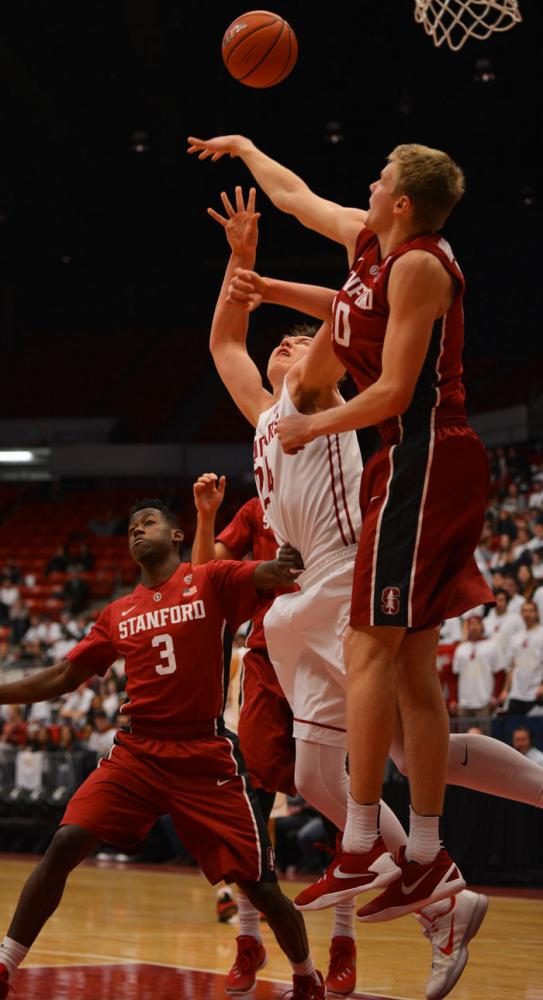 Junior+forward+Josh+Hawkinson+jumps+for+a+rebound+during+a+game+against+Stanford+at+Beasley+Coliseum+on+Feb.+18.